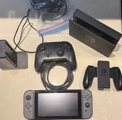 Nintendo Switch + Dock, Pro Controller, Joy-Con Charger, View more