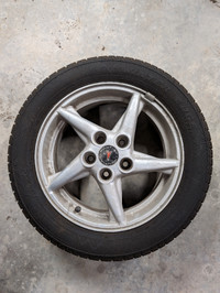 Four Pontiac alloy wheels with winter tires 205/55 R16
