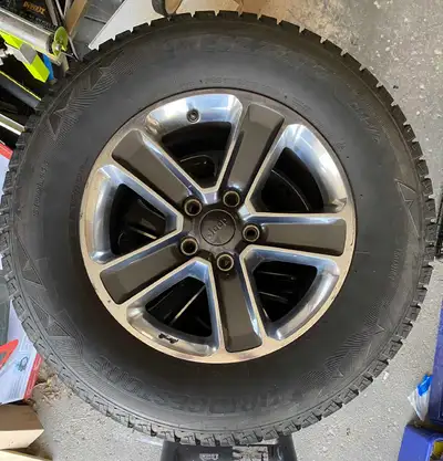 I'm selling a set of Jeep 18-inch 255-70-18 alloy rims mounted with Bridgestone DMZ snow tires, perf...
