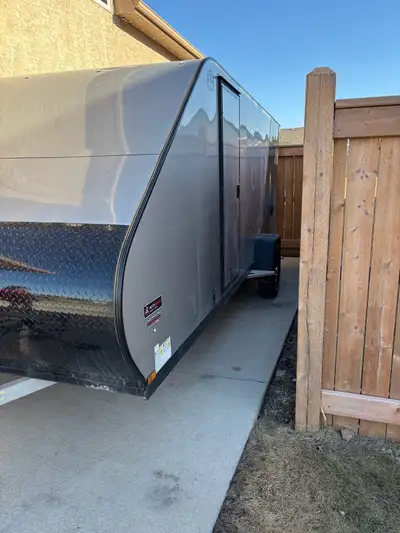 2026 enclosed snowmobile trailer. 7x16,spare tire,ski guides and track mat installed,rear stabilizer...