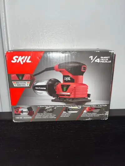 This is a new Skil 1/4 sheet palm sander, model 7292-02, featuring pressure control technology and m...