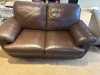 Dark brown leather love seat