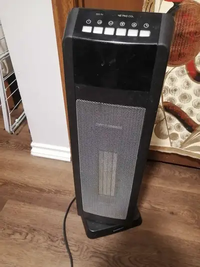 Garrison oscillating ceramic tower heater. Excellent for in home or a garage. $60 call 306-450-4263