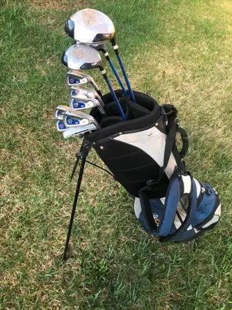John Daly mens  Golf clubs in a matching bag, View more
