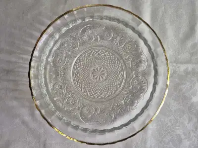Elevate your serving style with this elegant Jeannette Glass cake plate, featuring a clear pressed g...