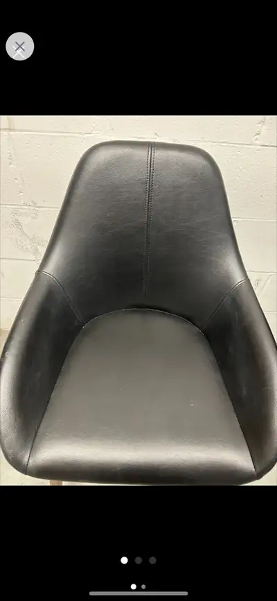 Stylish black leather dining chair. Wooden legs. Comfortable and elegant design. Perfect for a dinin...