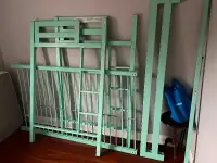 Steel bunk bed frame and mattress.