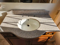 Granite vanity counter top with back splash. 