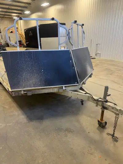 Tandem axle aluminum 4 place open trailer. Salt shield and rear ramp. Excellent condition. 22’ long.