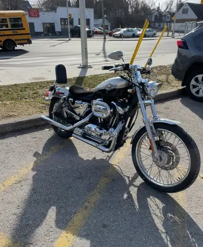 Immerse yourself in the classic American motorcycle culture with this 2003 Harley-Davidson Sportster...