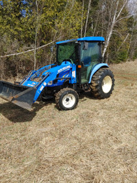 SOLD!  2014 New Holland tractor for sale with lots of implements