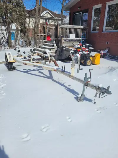 SINGLE AXEL BOAT TRAILER WITH ROLLERS , HAS A TWO SPEED WINCH WITH REVERSE , HAS TRAILER LIGHTS , TR...