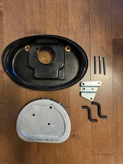 2007 Harley Davidson Fatboy original air cleaner includes filter/gasket; never used, new in box. $95...