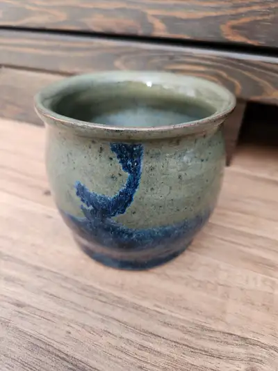 POTTERY dish for sale. Signed "Lisa G" underneath. Dark green with blue colours (brown accent). Deep...