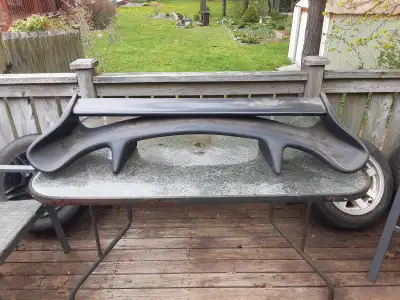 Big spoiler! Top bar can be removed easily for a different look. Has some cracks through out (fiberg...