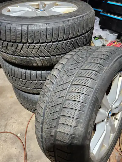 For sale 4 winter Pirelli flat run tires with bmw x 5 rims . 5 -120 . thread depth around 6-7 /32 ....