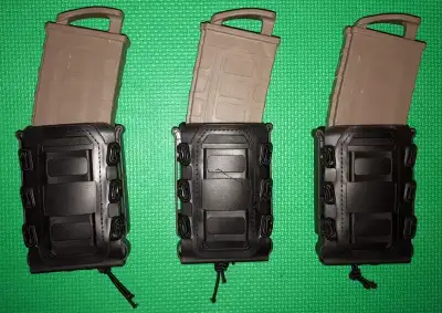 These mag holders are brand new. There is an elastic cord on them so you can adjust the tension. The...