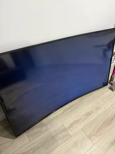 65 inch Haier Curved TV / cracked panel – powers on – parts only, View more
