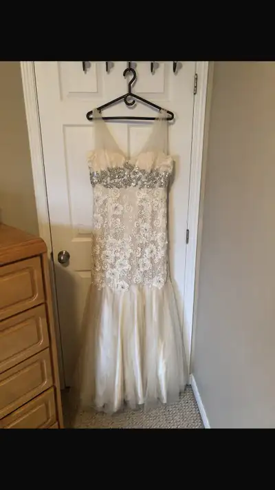 Item: Wedding Gown. Condition: Like New, Worn only once. Colour: Ivory Original price: $700, asking...