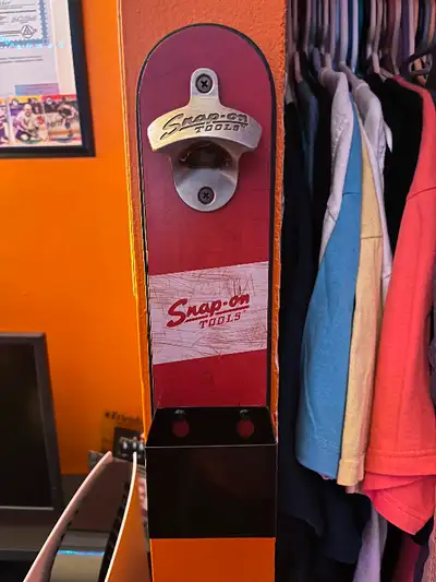 Snap on hanging bottle opener. Just been hanging on the wall looking to sell 40$