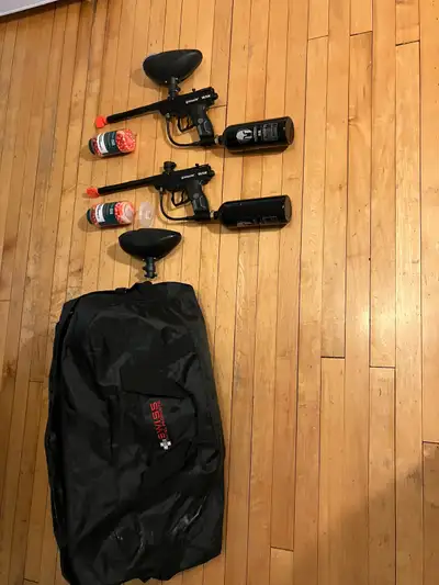 2 paintball rifles with Co2 tanks and multiload ammo bins. Comes with carrying bag.They work perfect...