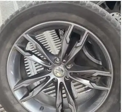 265/50R19 Michelin X-Ice winter tires mounted on rims. These tires will fit a 2022 BMW X6 and are in...
