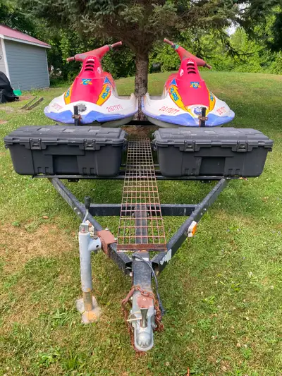 Double trailer with registration & 2 skis with papers 1 needs top end refresh 1 is parts machine