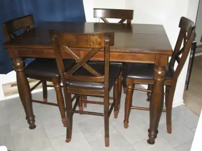 solid dark oak table and 4 chairs , excellent condition, View more