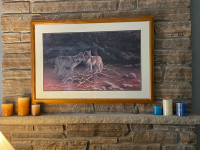 Large beautiful framed print of wolves at a river 