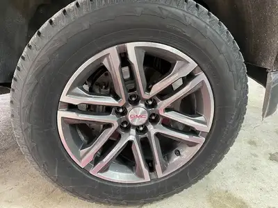 Set of 4 Hankook 265/60R18 110T winter tires on custom GMC rims equipped with TPMS tire sensors for...