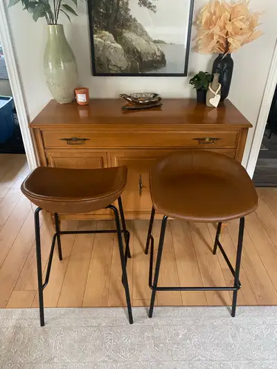 Almost new brown leather bar stools, sturdy and wide seat. Were used for staging to sell my last hou...