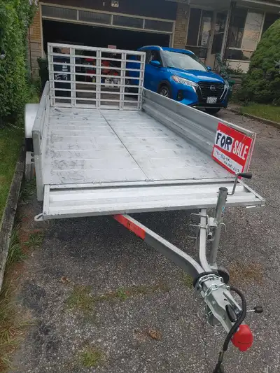 This is a Stirling trailer, model 60-120-TRIM. It has a payload capacity of 2100 lbs, interior width...