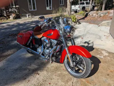 I am selling my used 2015 Harley-Davidson Dyna Switchback, featuring a vibrant red exterior and equi...