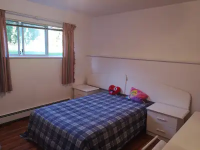 Bright and spacious upstairs private room available in a quiet shared home near Simon Fraser Univers...