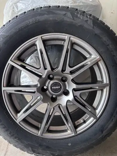 Winter tires and rims from a QX60 2024. Rims are in good shape and tires may have one season left. S...