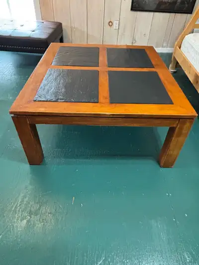 Beautiful teak and slate coffee table. It will enhance any decor.