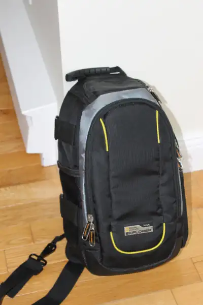 National Geographic explorer camera bag . Lots of side pockets to store things including camera.