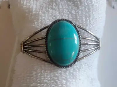 This is a beautiful Southwestern Native American sterling silver cuff bracelet featuring a striking...
