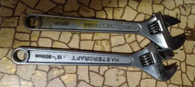 Upgrade your tool collection with this set of reliable adjustable wrenches featuring a 12-inch Maste...