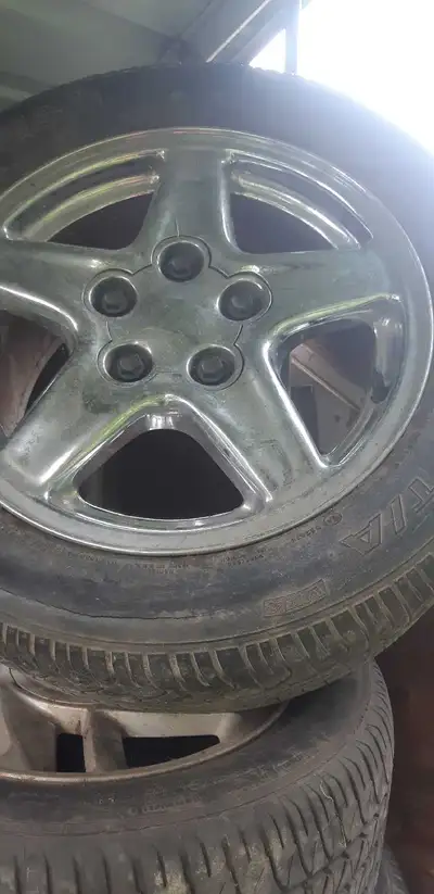 4 rims / center caps,with tires...245/50/16..tires are weather cracked..They were on a 1997 camaro z...