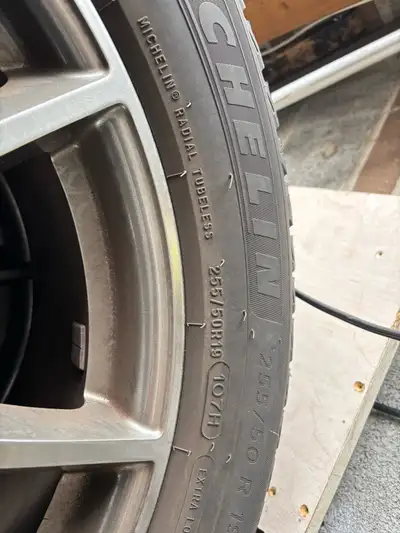 I am selling a set of four used Michelin X-ICE SNOW winter tires mounted on BMW rims, size 255/50R19...