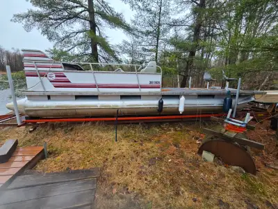 24’ Lavigne Pontoon Boat with 75hp Mercury 2 stroke Good Condition, 23” diameter pontoons Bought as...