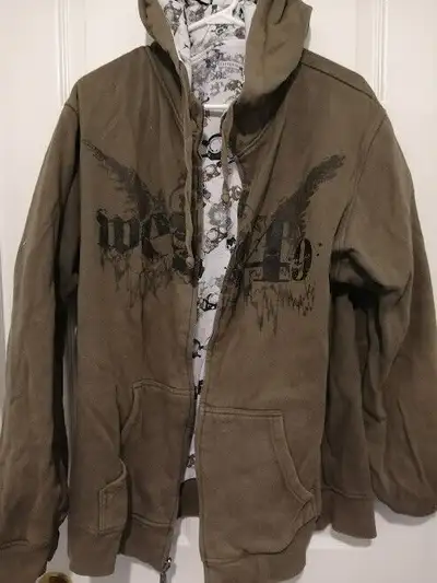 A Reversible Hoddie Jacket in good condition, olive green on one side, white with black print on oth...