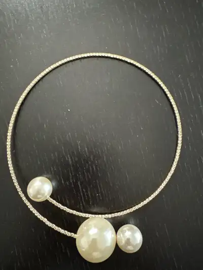 Add a touch of vintage elegance to your collection with this gold-tone choker featuring three faux p...