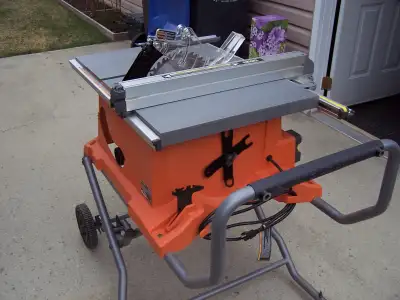 As New Ridgid 15 Amp 10 inch portable Table Saw with folding stand plus accessories. Cut only 6 ceda...