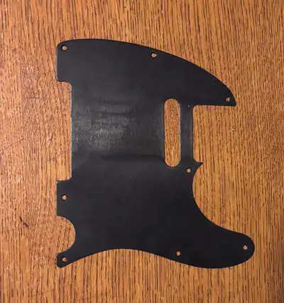 Metal telecaster pickguard. Black in colour. $40 obo
