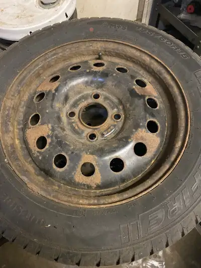 These are a set of used winter tires, sized 195 60R15, mounted on steel rims, perfect for getting th...