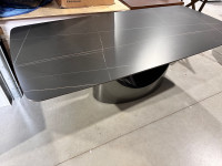 Black stone dining table with grey carbon steel leg 