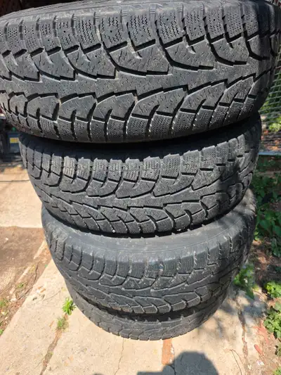 These are a set of four used winter tires, sized at 265/70R17, ready to tackle the snowy Canadian ro...
