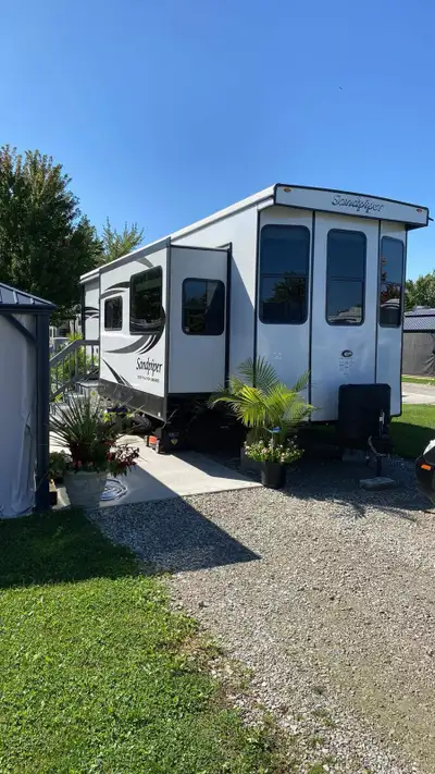 This is an amazing Destination trailer located at Wildwood Seasonal Resort in McGregor Unit has hotw...